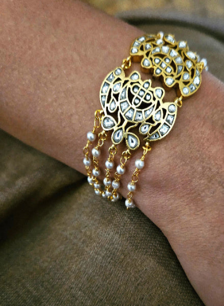 Pearl and kundan multi string bracelet